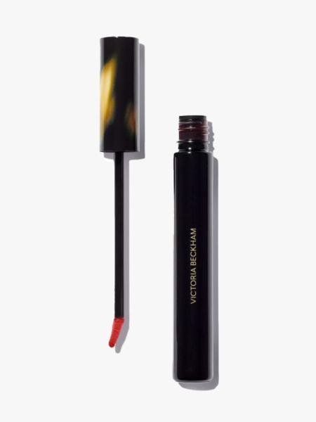 Victoria Beckham Beauty Bitten Lip Tint black vial with tortoise cap and wand to the side on light gray background